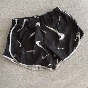 Nike Black Athletic Shorts with Silver Swoosh Pattern - youth L